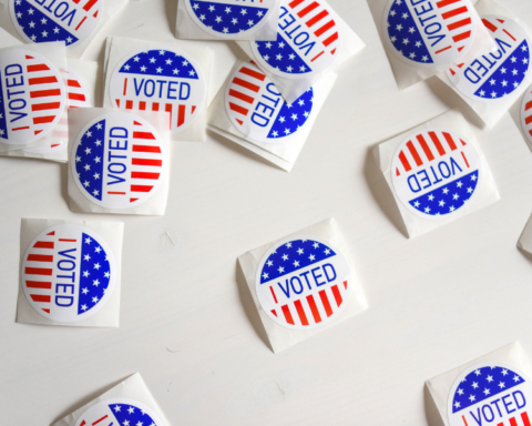 Photo of many colorful stickers that say "I Voted"