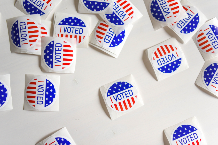 Photo of many colorful stickers that say "I Voted"