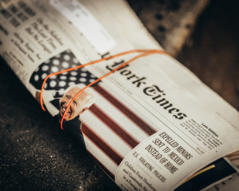 A folded up newspaper with a photo of Joe Biden and the headline "Expelled Minors Sent to Mexico Instead of Home"