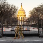 Two members of the National Guard stand outside the U.S. Capitol before the Inauguration of Joe Biden.