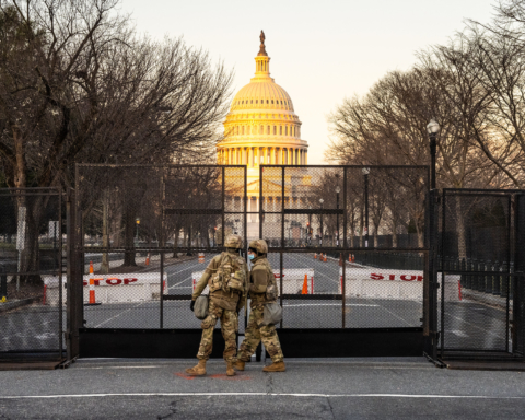 Two members of the National Guard stand outside the U.S. Capitol before the Inauguration of Joe Biden.