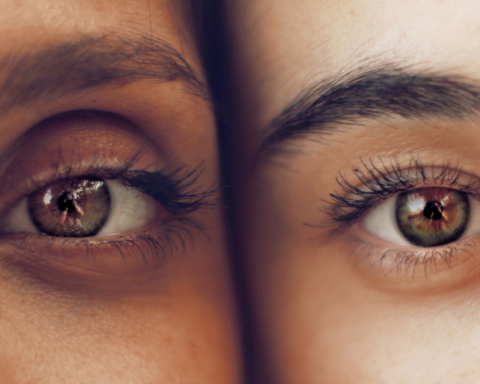 The eyes of two women of color look out.
