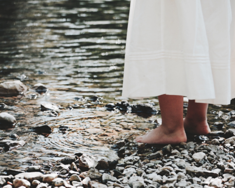 Bare feet on a stony bank