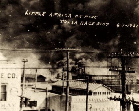 A photo of the fi. Text reads 'Little Africa on fire. Tulsa Race Riot, June 1st, 1921'