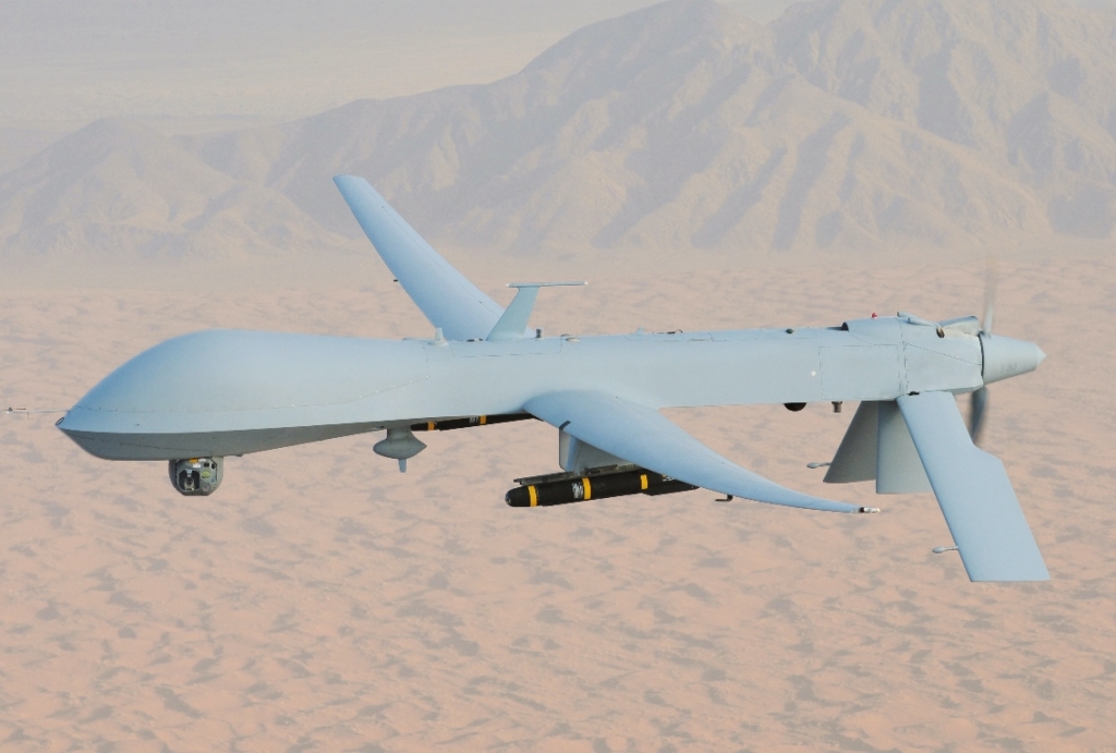 A photograph of a drone piece of weaponry, the General Atomics RQ-1A Predator. It resembles a windowless commercial airline.