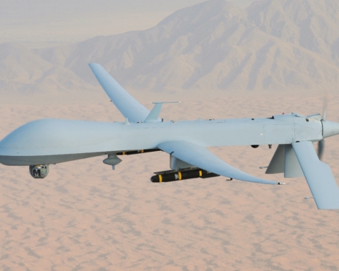 A photograph of a drone piece of weaponry, the General Atomics RQ-1A Predator. It resembles a windowless commercial airline.